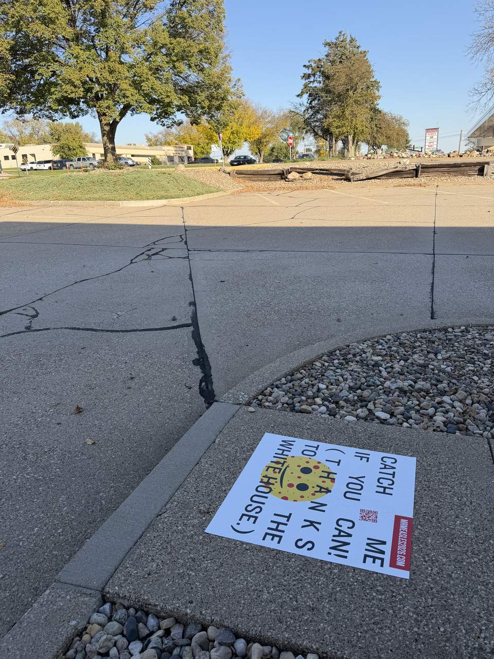 Sidewalk decal at a retail entrance, Sioux City, IA